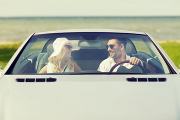 Image showing happy man and woman driving in cabriolet car