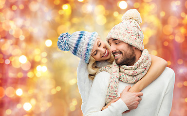 Image showing smiling couple in winter clothes hugging