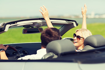 Image showing happy man and woman driving in cabriolet car