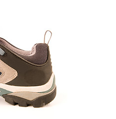 Image showing clothes hiking boots or shoes isolated on a withe background made of leather and waterproof and breathable membrane