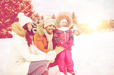 Image showing happy family with child in winter clothes outdoors