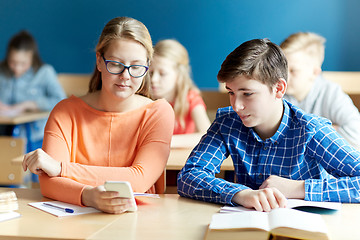 Image showing students with smartphone texting at school