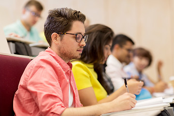 Image showing group of students with notebooks in lecture hall