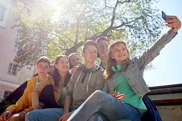 Image showing happy teenage students taking selfie by smartphone