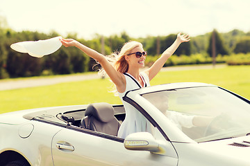 Image showing happy man and woman driving in cabriolet car