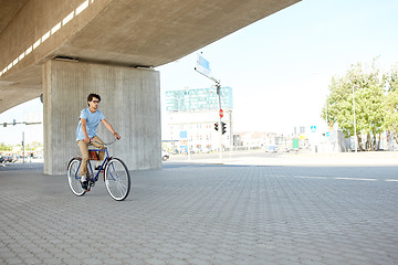 Image showing young hipster man riding fixed gear bike