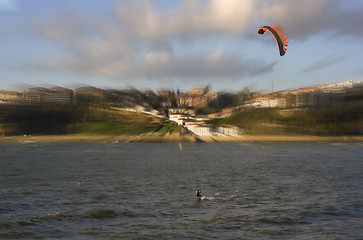 Image showing beach sport water kite surf. a man practicing kite surfing in the beach