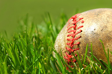 Image showing Old baseball glove on the grass