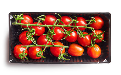 Image showing fresh red tomatoes in a plastic box