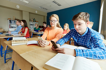 Image showing students with smartphone texting at school