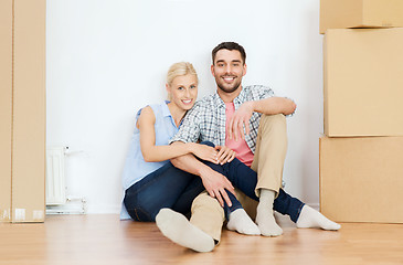 Image showing couple with cardboard boxes moving to new home