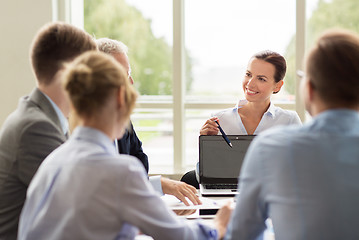 Image showing business people with laptop meeting in office