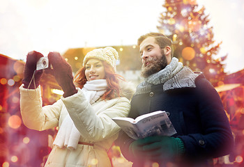 Image showing couple taking selfie with smartphone in old town