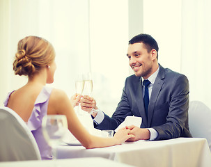 Image showing couple with glasses of champagne at restaurant