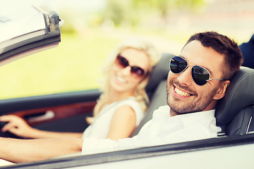 Image showing happy man and woman driving in cabriolet car