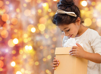 Image showing smiling little girl with gift box