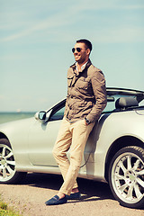 Image showing happy man near cabriolet car outdoors