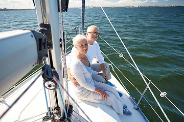 Image showing senior couple hugging on sail boat or yacht in sea