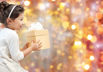 Image showing smiling little girl with gift box