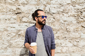 Image showing man drinking coffee from paper cup on street