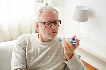 Image showing old man using voice command recorder on smartphone