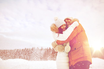 Image showing happy couple hugging and laughing in winter
