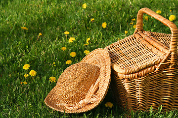 Image showing Summer hat and wicker basket