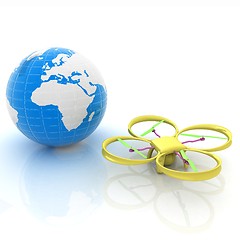 Image showing Quadrocopter Drone with Earth Globe and remote controller on a w