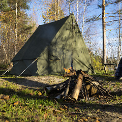 Image showing Retro tent in forest and camp fire