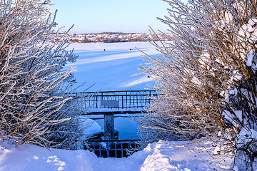 Image showing Winter sunny landscape with river and forest