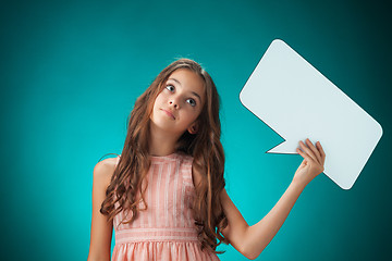 Image showing The cute cheerful little girl on orange background