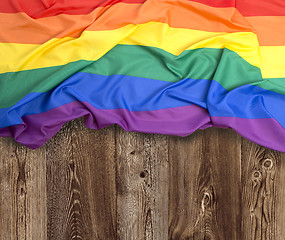 Image showing Rainbow flag on wooden background 