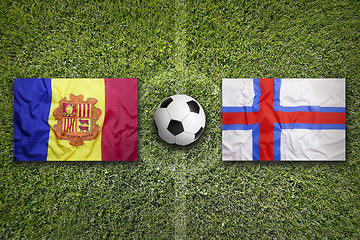 Image showing Andorra vs. Faroe Islands flags on soccer field