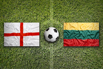 Image showing United Kingdom vs. Lithuania flags on soccer field