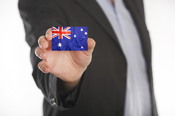 Image showing Businessman holding business card with Australian flag