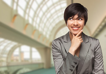 Image showing Businesswoman Inside Corporate Building Looking To The Side