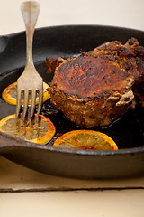 Image showing pork chop seared on iron skillet