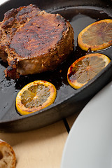 Image showing pork chop seared on iron skillet