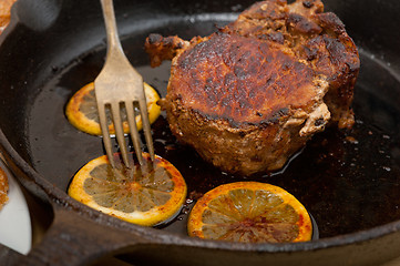 Image showing pork chop seared on iron skillet