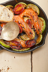 Image showing roasted shrimps with zucchini and tomatoes