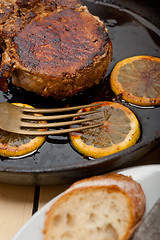 Image showing pork chop seared on iron skillet