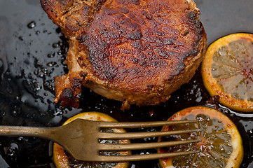 Image showing pork chop seared on iron skillet