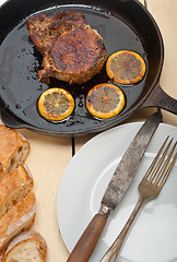 Image showing pork chop seared on iron skillet