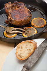 Image showing pork chop seared on iron skillet