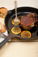 Image showing pork chop seared on iron skillet