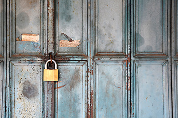 Image showing Metal lock on a blue door