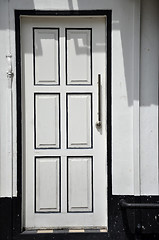 Image showing White wall with white door