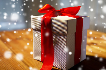 Image showing close up of christmas gift box on wooden table