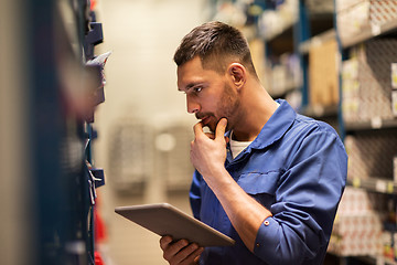 Image showing auto mechanic or smith with tablet pc at workshop