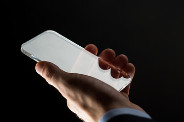 Image showing close up of businessman with glass smartphone